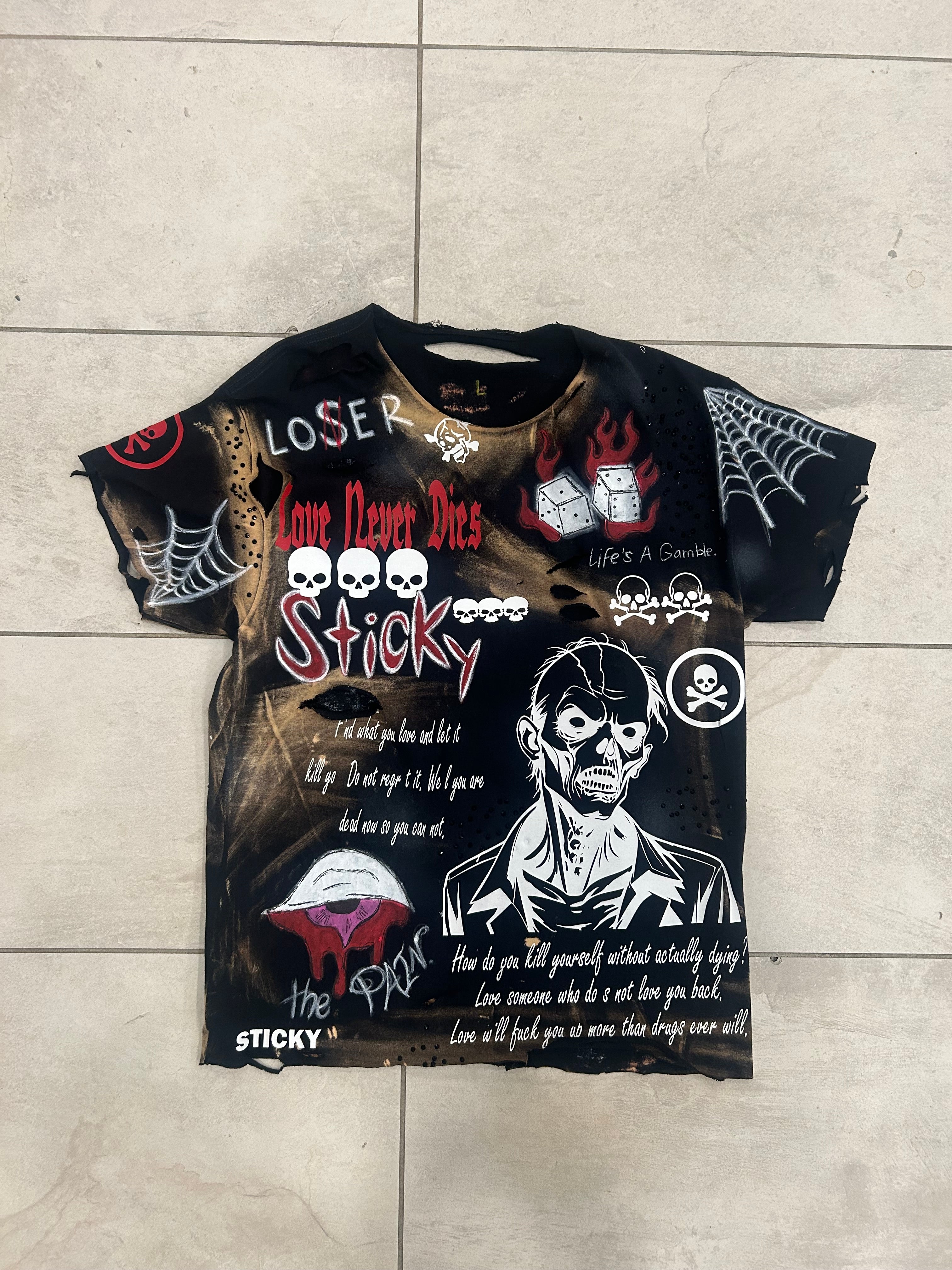 Sticky “We’re Still Losing” Tee
